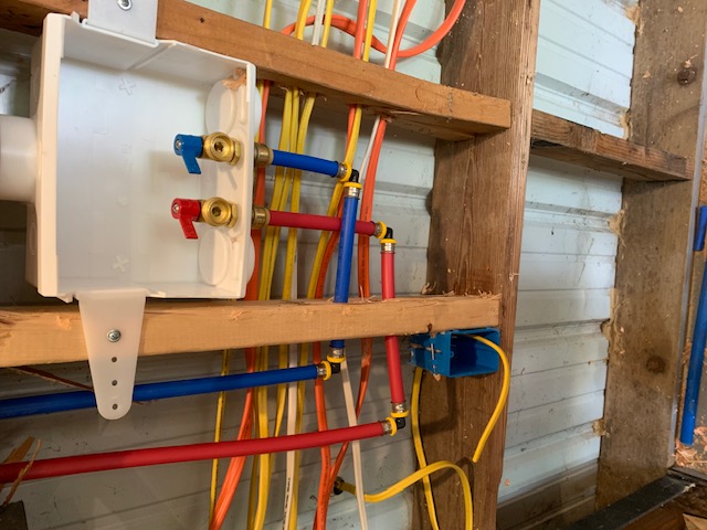exposed bathroom plumbing which is newly installed pex pipes
